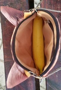 You can fit a banana lengthwise into Oliver the cat faced chain bag. I guess. If you want to.