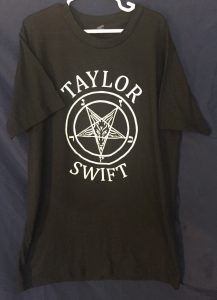 Twelve Days of Catmas - Day Thirteen - Taylor Swift and Satan seem pretty close. I've never been to a show but this shirt makes it look pretty rad.